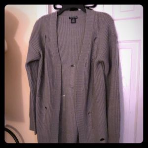 A gray distressed sweater 🌸🌸🌸